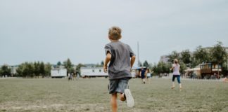 kid running in the field