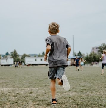 kid running in the field